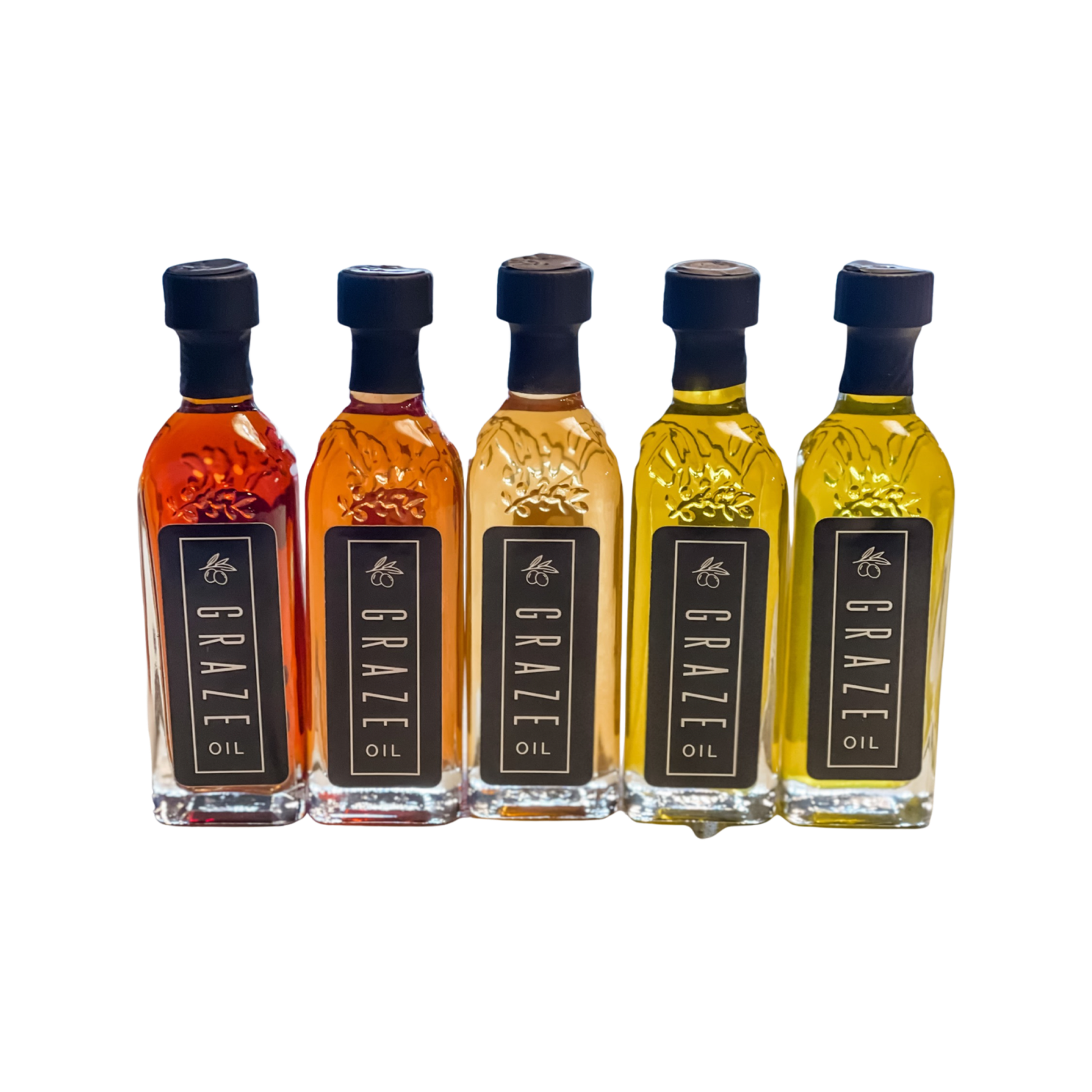 Five mini  bottles of Graze Oil with different colors on a white background